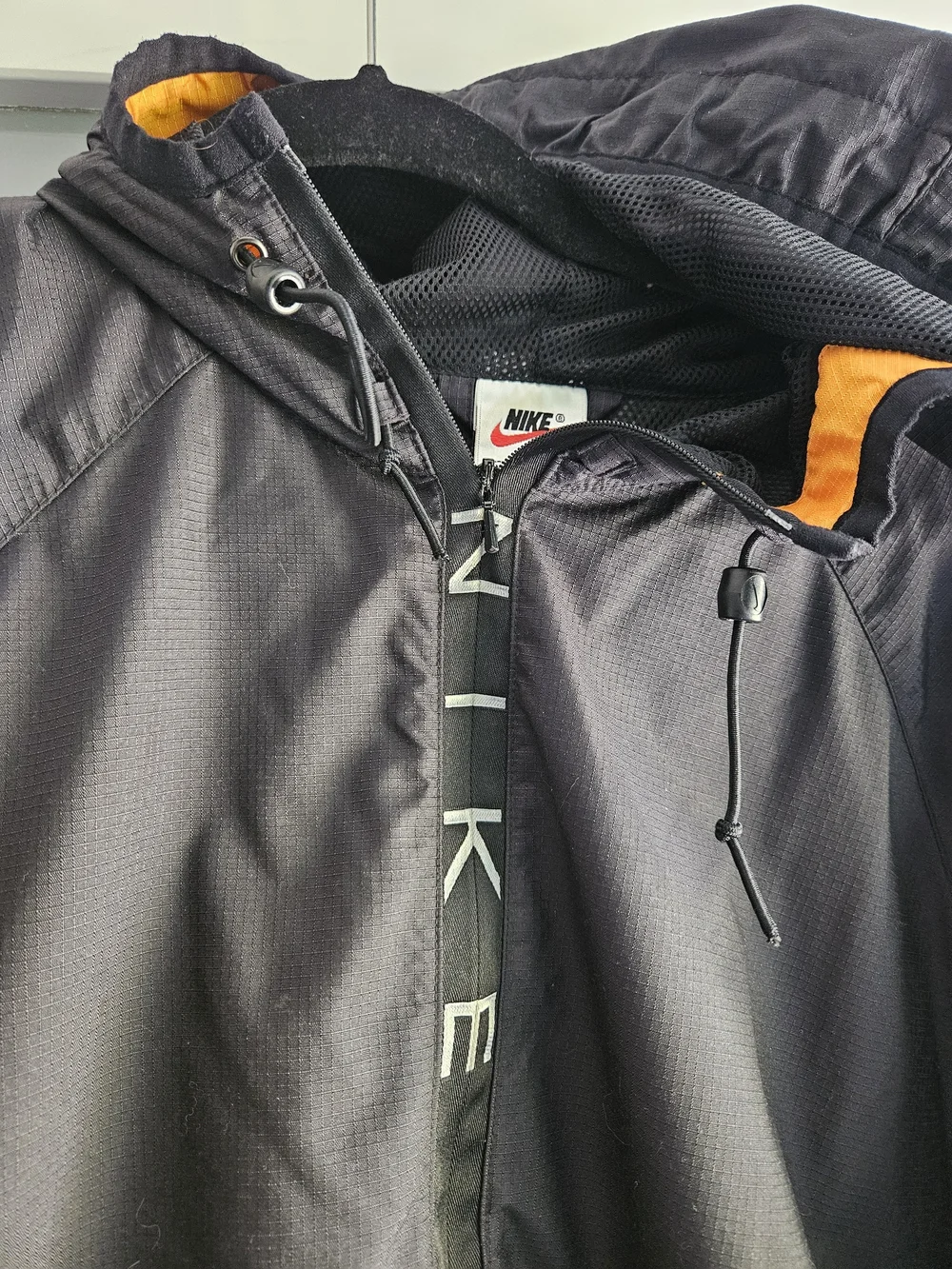 Nike Black Windbreaker Jacket with Orange Accents